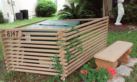 green electrical box in backyard put up privacy fence|landscaping to hide utility box.